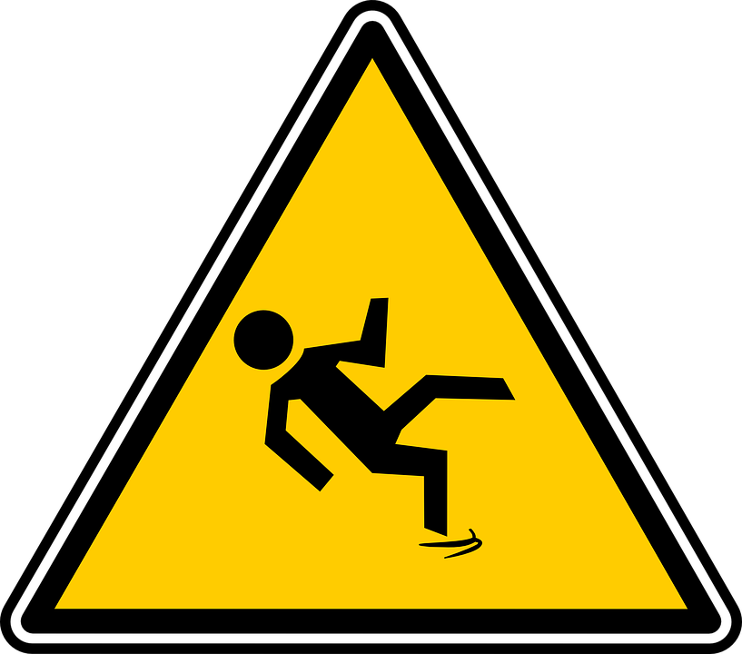 yellow caution sign with an icon of a person slipping and falling