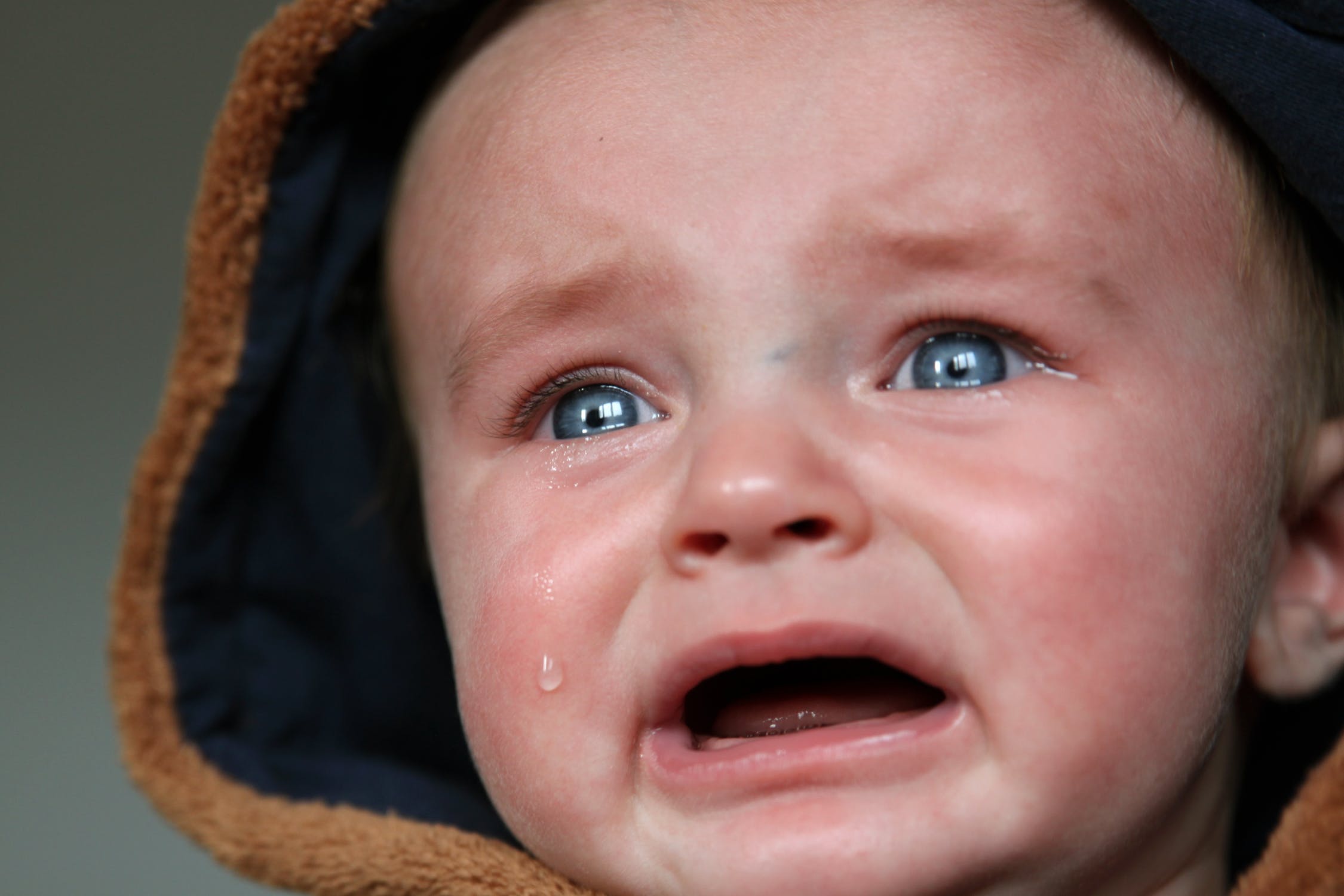 close up of an infant crying after being abused | Berry Law | Omaha