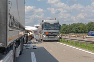 Semi Trucks and Camper Trailer Traffic Accident at Highway in Omaha NE