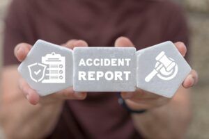 sign with accident report and gavel