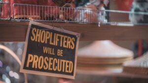 Shoplifters will be prosecuted sign in a store