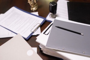 Stack of juridical documents in folders and clipboards