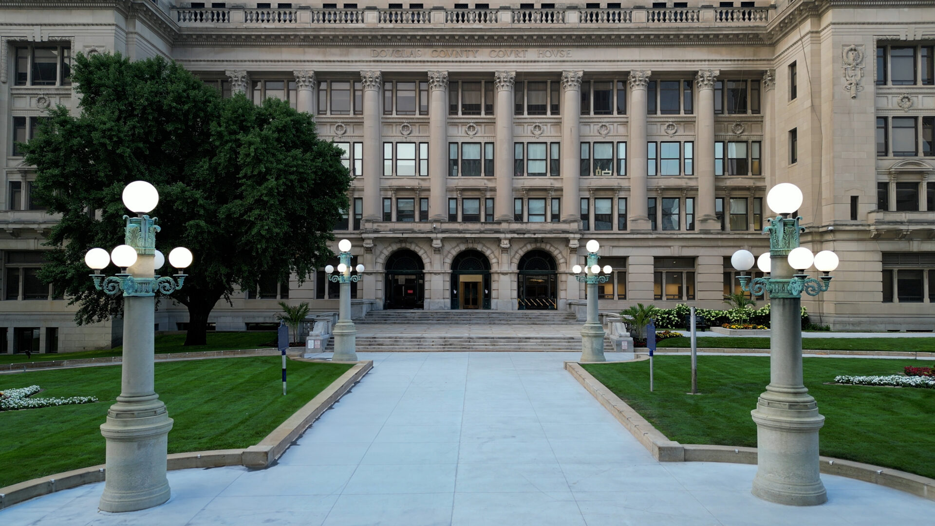 front view of the douglas county courthouse in downtown omaha just before dawn on a summer morning
